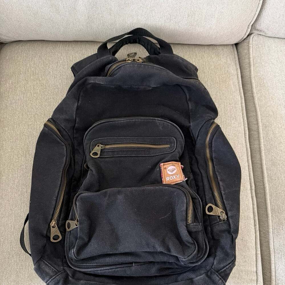 Vintage Roxy canvas multi-pocket backpack. Classic Bronze zippers.